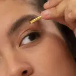 Tweezing - DIY hair removal with tweezers - if painful and ineffective. | Woman's face with tweezers shown.